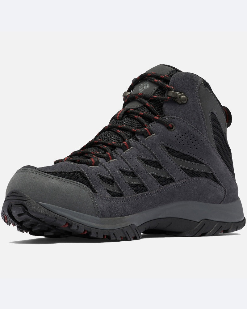 מגפי הטיולים ColumbiaIL Crestwood Mid Waterproof M בצבעי שחור ואפור כהה עם נגיעות אדומות, כוללים סוליה עמידה, לוחות רשת וקצה מחוזק, כפי שנראים בזווית נמוכה.