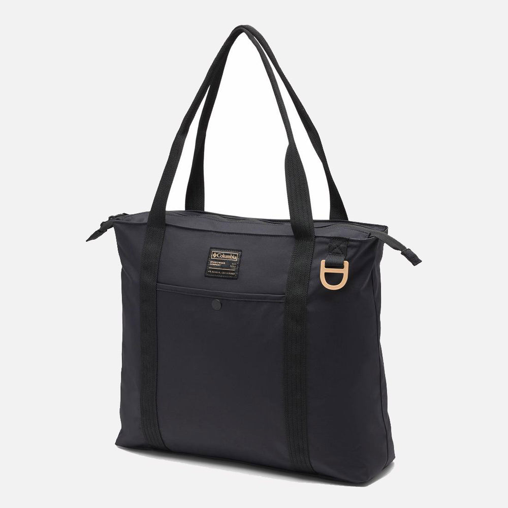 תיק ה-Cottonwood Creek Tote של קולומביה ישראל הוא תיק שחור עם ידיות ארוכות, סגירת רוכסן בחלק העליון, כיס קדמי קטן, תווית לוגו מלבנית ופרט של טבעת D בצבע חום בהיר בפינה הימנית העליונה.