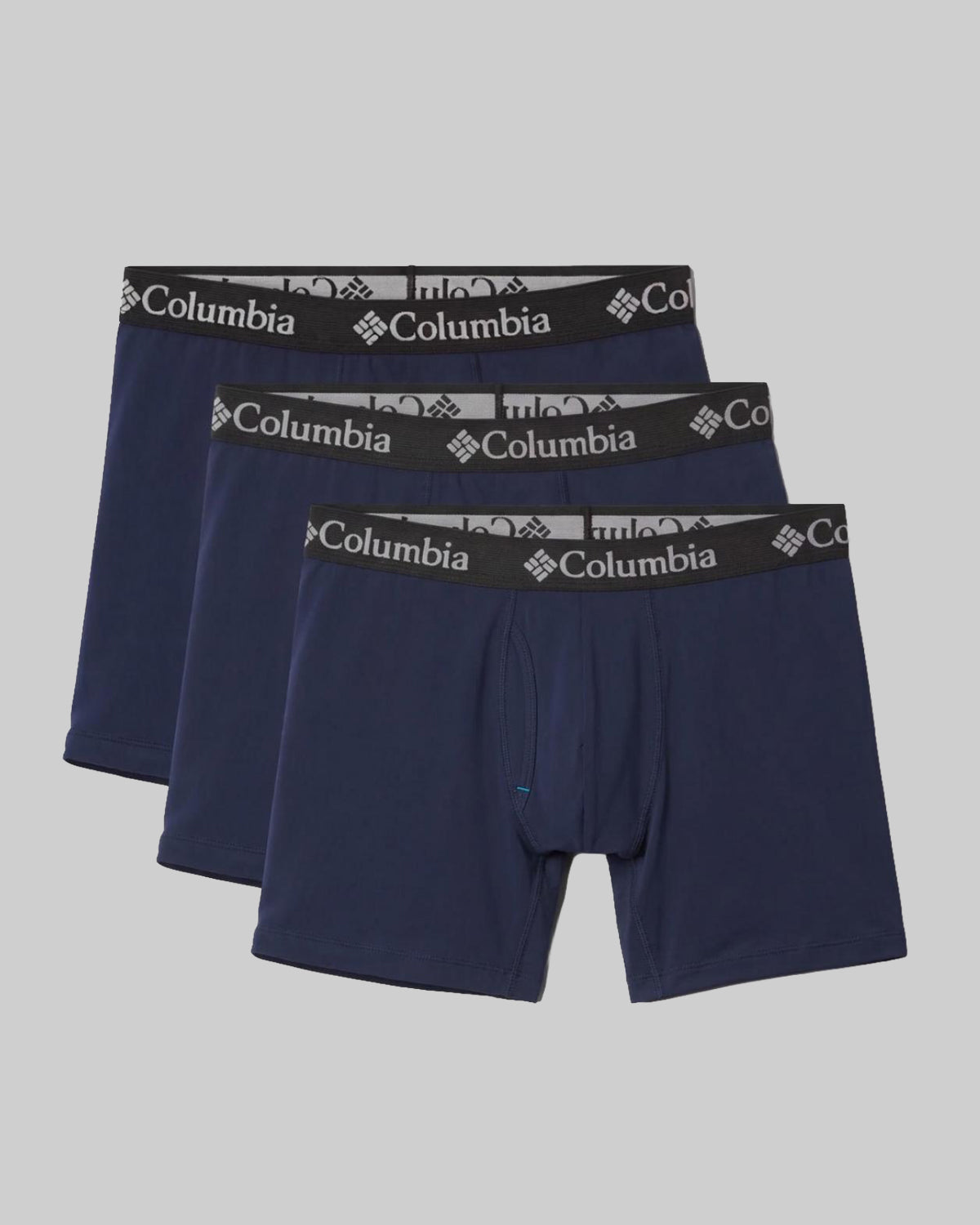 הסט "קולומביה ישראל Col Poly Stretch 3pk" כולל שלושה תחתוני בוקסר בצבע כחול כהה עם חגורות מותן שחורות ולוגו קולומביה לבן, העשויים מבד פוליאסטר נמתח ונוח, המוצגים מוערמים על רקע אפור בהיר — אידיאליים ללבישה יומיומית.