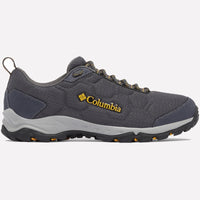 נעלי טיולים מדגם Firecamp Remesh של ColumbiaIL בצבע אפור, עם נגיעות של שחור וצהוב, לוגו צהוב בצד, סוליה מגומי מחוספסת ושרוכים אפורים, מוצגות בצילום צדדי על רקע בהיר אחיד.
