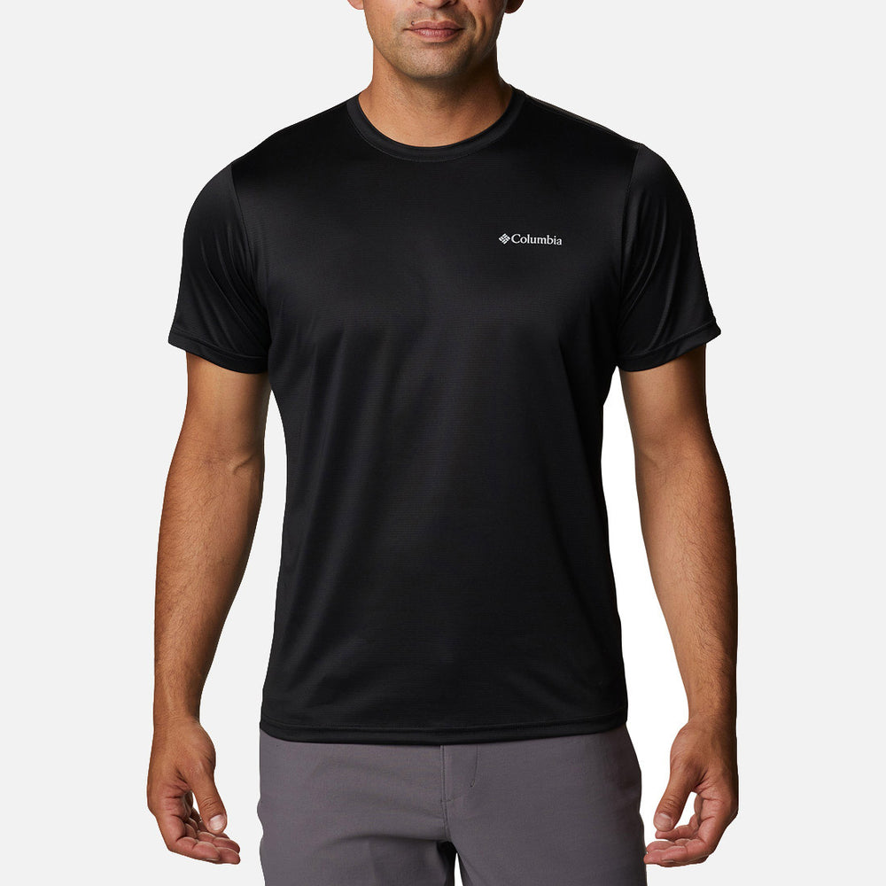 A man in a Columbia Hike Crew Black short-sleeve T-shirt and gray pants stands facing forward against a white background, with the Columbia logo displayed on the left chest.