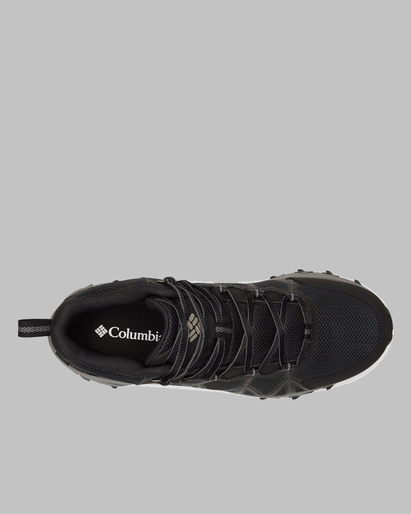 מבט מלמעלה על נעל ספורט שחורה מדגם Peakfreak II Mid Outdry מבית columbiaIL, עם שרוכים שחורים, בד רשת ולשונית משיכה בעקב — מושלמת לשימוש בחוץ — מוצגת על רקע אפור אחיד.