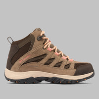 מגפי הטיולים לנשים "קולומביה ישראל Crestwood Mid Waterproof W" כוללים חלק עליון בצבעי חום ובז' עם נגיעות ורודות, לוחות רשת, סוליה עמידה מגומי ושרוכים צבעוניים. הדגם בגובה בינוני מוצג על רקע אפור אחיד.