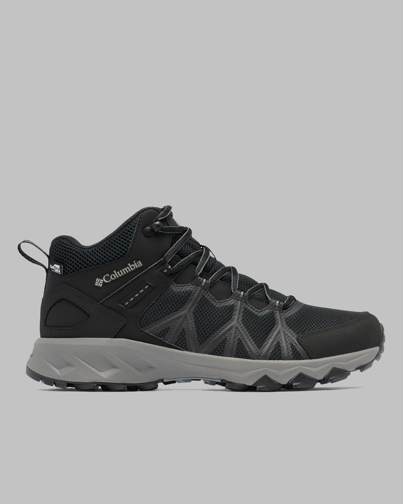 מגף טיולים לגברים מדגם Columbia IL Peakfreak II Mid Outdry M בצבעי שחור ואפור, עם סוליה עמידה, חלק עליון מרשת וסגירת שרוכים, מוצג בפרופיל צדדי על רקע אפור אחיד.