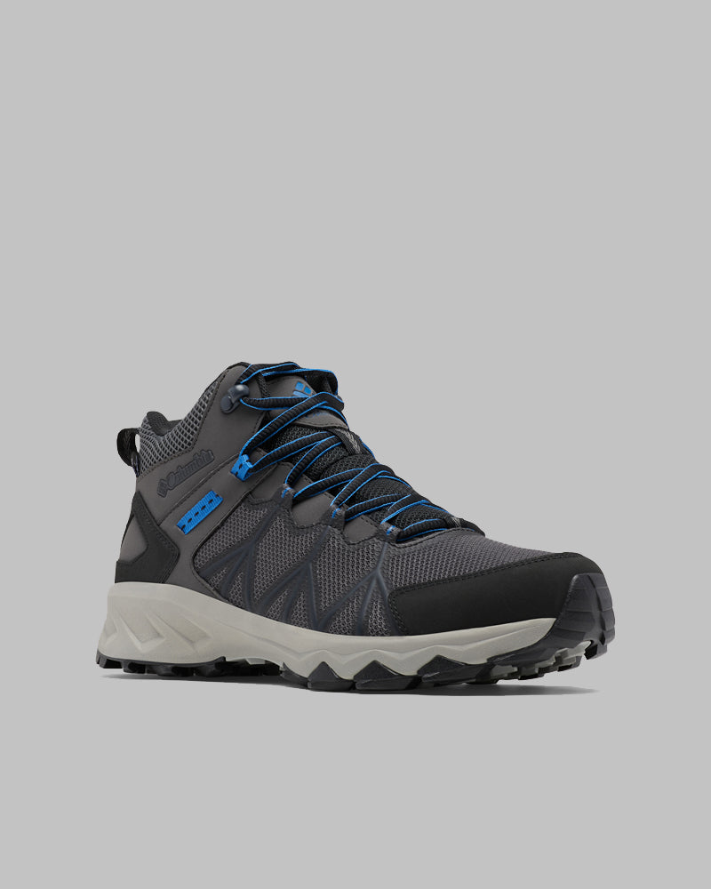 מגפי הטיולים לגברים ColumbiaIL Peakfreak II Mid Outdry M מתאפיינים בעיצוב בצבעים אפור ושחור עם נגיעות של כחול, בסוליה עמידה עם אחיזה חזקה ובהגנה אטומה למים של Outdry, המוצגים על רקע אפור בהיר.