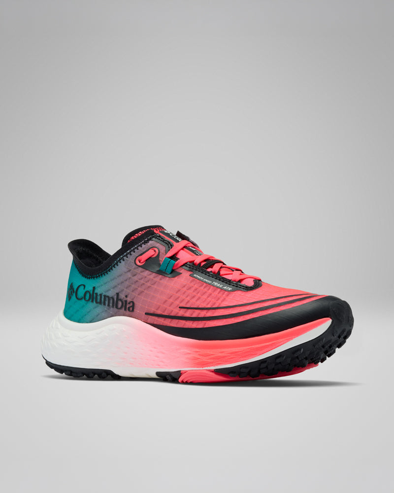 דגם Konos Speed Trail Atr W מבית קולומביה ישראל הוא נעל ריצת שטח בעיצוב עם מעבר צבעים מוורוד, אלמוג וכחול-ירוק, עם נגיעות שחורות, סוליה לבנה מרקמת ולוגו של קולומביה בצד, המוצג על רקע אפור בהיר אחיד.