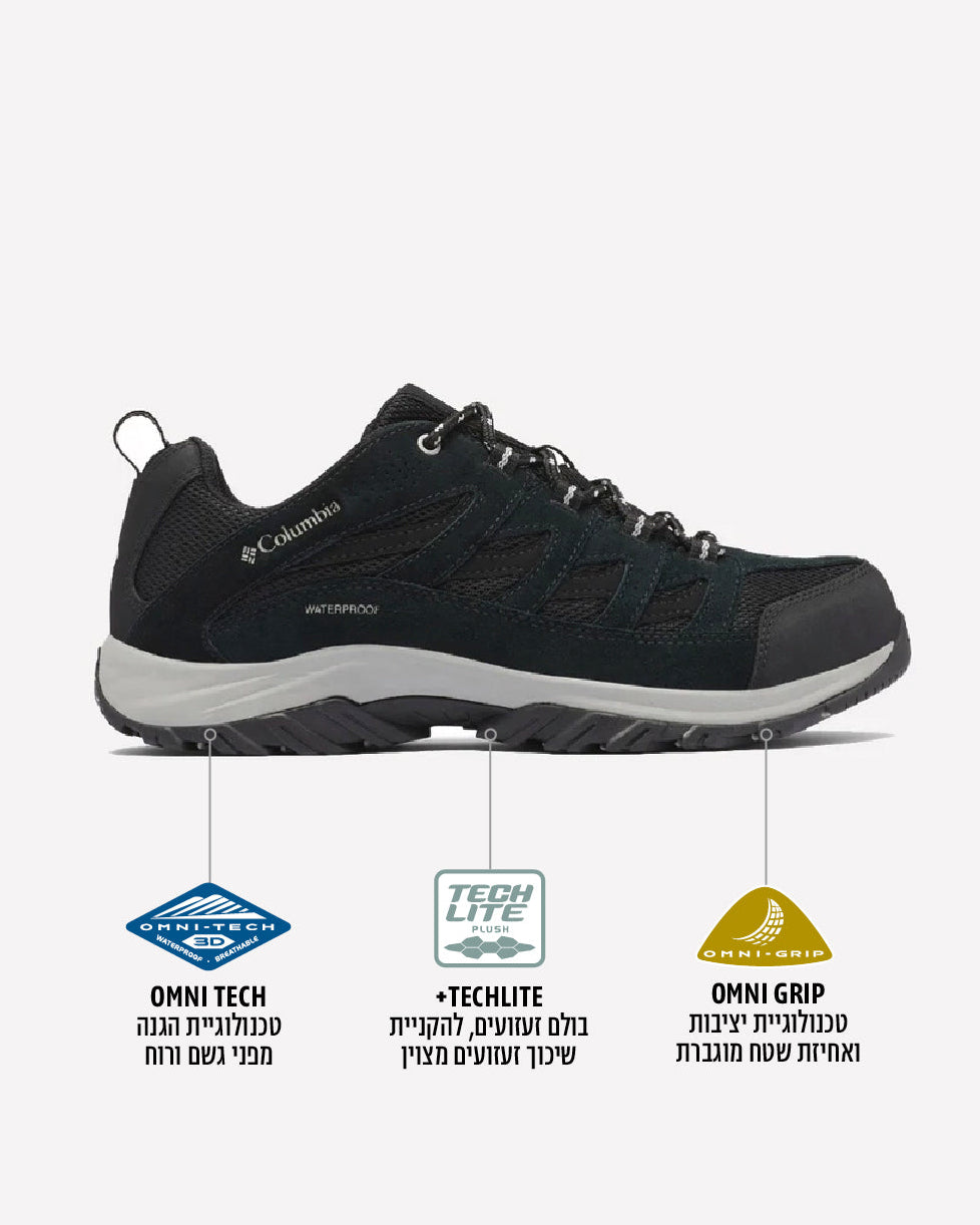 נעל טיולים לגברים מדגם Crestwood Waterproof M של חברת columbiaIL בצבע שחור, עם סוליה עמידה, מוצגת בפרופיל. שלוש אייקונים מדגישים את טכנולוגיית Omni-Tech למניעת חדירת מים, את סולית הביניים הקלה Techlite ואת סולית החוץ Omni-Grip, עם תיאורים בעברית מתחת.